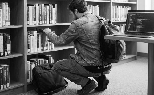 Engineer searching a reference library